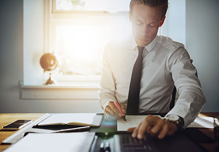 man at home working in his office man at home working in his office