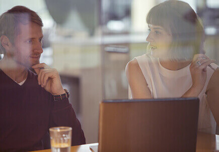 Couple working at a desk. Couple working at a desk.