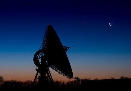 Satellite dish with nightsky behind Satellite dish with nightsky behind