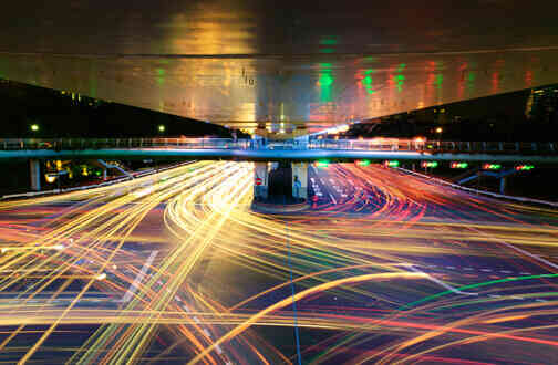 Car lights at night moving, creating light lines Car lights at night moving, creating light lines