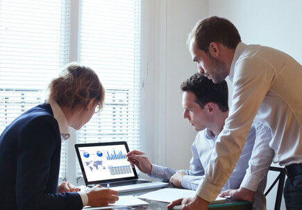 Men looking at a laptop Men looking at a laptop
