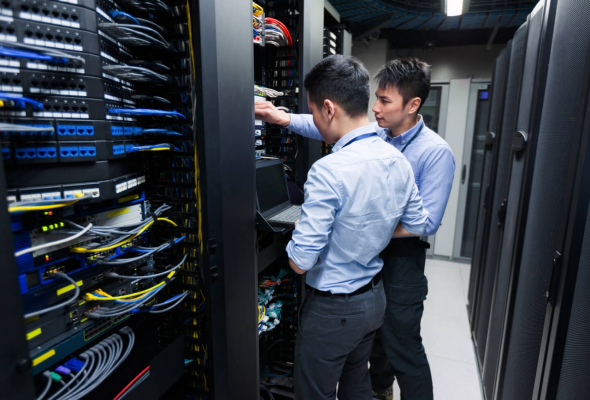 Two men working at a server