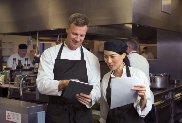 Chefs using tablets at work