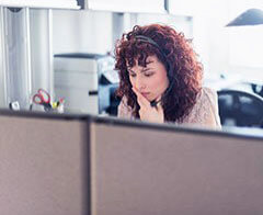Woman on the phone via a headset Woman on the phone via a headset