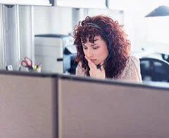Woman on the phone via a headset Woman on the phone via a headset