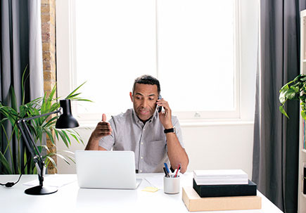 Man working in his home office Man working in his home office