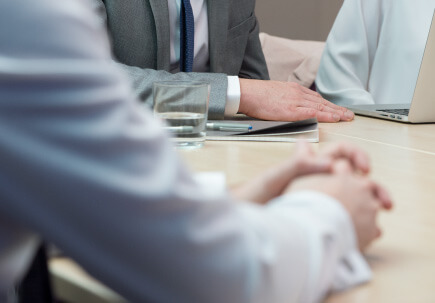 image of people at a desk