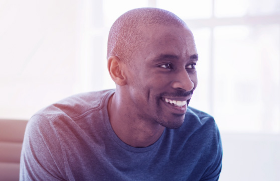 A man smiling at how easy it is to work with BT A man smiling at how easy it is to work with BT