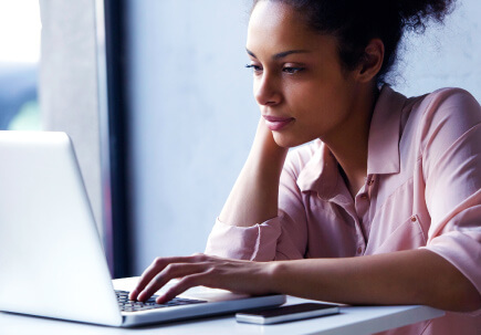 A woman’s checking out which software’s available A woman’s checking out which software’s available