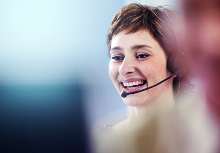Customer support agent engaging with someone over a headset Customer support agent engaging with someone over a headset